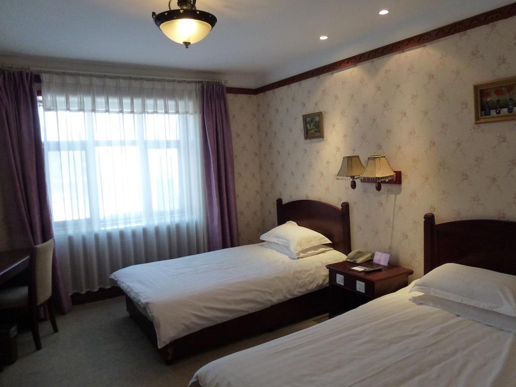 Hotel Harbin Volgamanor à Acheng Chambre photo