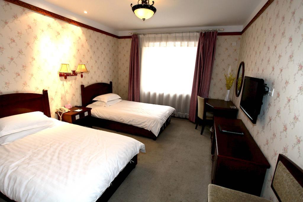 Hotel Harbin Volgamanor à Acheng Chambre photo